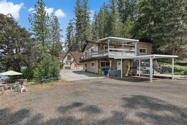 6519I Myrtle Dr, Nine Mile Falls, WA 99026 - view of front facade with stairway, a deck, and a carport