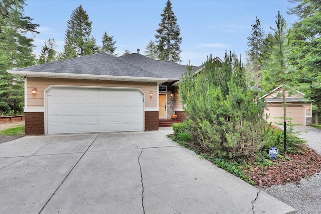 13306 N Muzzy Rd, Newman Lake, WA 99025 - view of front of home with driveway, roof with shingles, and an attached garage