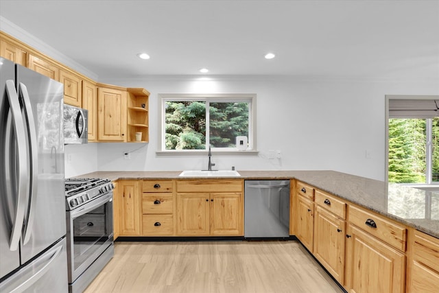 13306 N Muzzy Rd, Newman Lake, WA 99025 - kitchen featuring appliances with stainless steel finishes, light brown cabinets, light stone counters, light wood-style flooring, and recessed lighting
