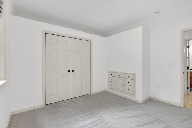 13306 N Muzzy Rd, Newman Lake, WA 99025 - unfurnished bedroom featuring light carpet, ornamental molding, and a closet