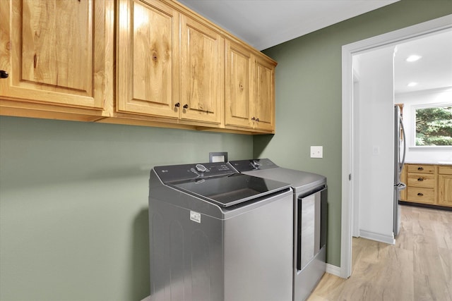 13306 N Muzzy Rd, Newman Lake, WA 99025 - laundry area with cabinet space, washing machine and clothes dryer, light wood-type flooring, and recessed lighting