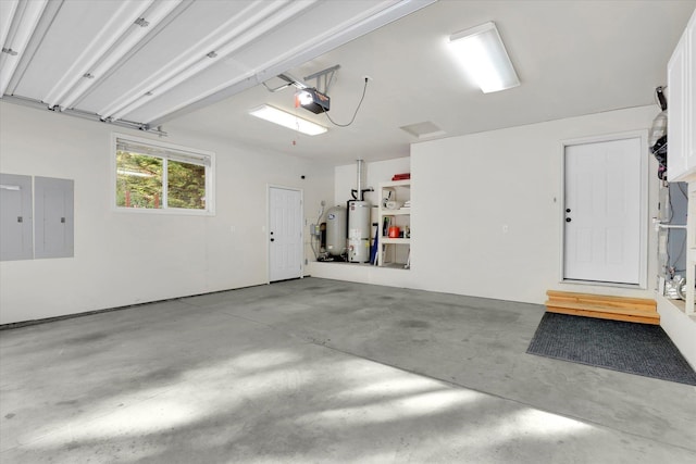 13306 N Muzzy Rd, Newman Lake, WA 99025 - garage with secured water heater, electric panel, a garage door opener, and water heater