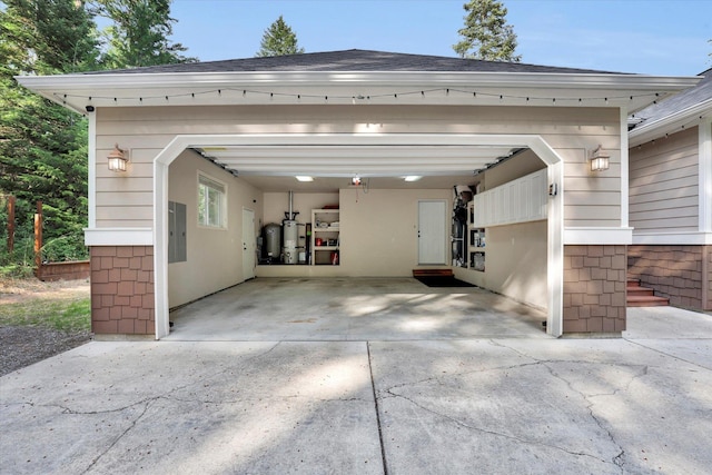 13306 N Muzzy Rd, Newman Lake, WA 99025 - garage with electric panel, water heater, and concrete driveway