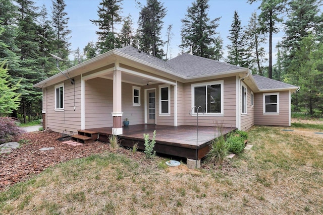 13306 N Muzzy Rd, Newman Lake, WA 99025 - view of front of home featuring a deck, roof with shingles, and a front yard