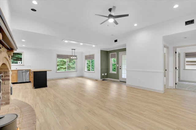 13306 N Muzzy Rd, Newman Lake, WA 99025 - unfurnished living room featuring light wood-style floors, ceiling fan, recessed lighting, and a large fireplace