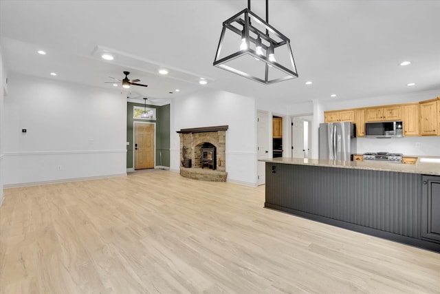 13306 N Muzzy Rd, Newman Lake, WA 99025 - kitchen featuring stainless steel appliances, open floor plan, recessed lighting, ceiling fan, and a fireplace