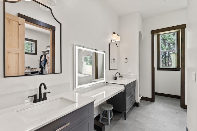 7617 S Cedar Rd, Spokane, WA 99224 - bathroom with healthy amount of natural light, vanity, and a walk in closet