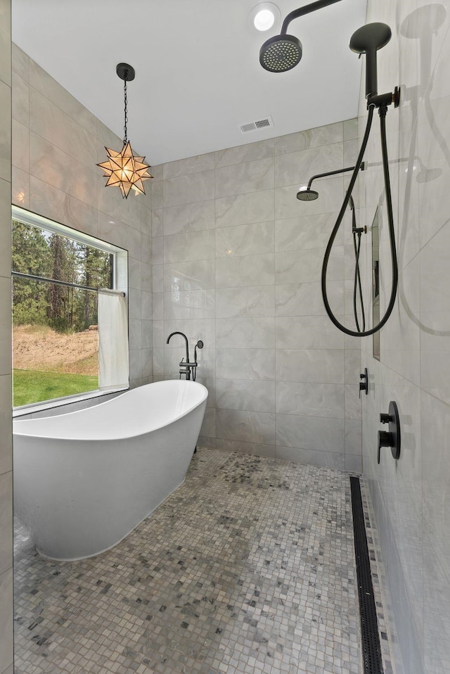 7617 S Cedar Rd, Spokane, WA 99224 - full bath with tiled shower, a freestanding bath, and tile walls