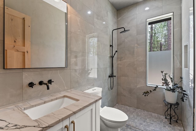 7617 S Cedar Rd, Spokane, WA 99224 - full bath featuring a tile shower, vanity, tile walls, and backsplash