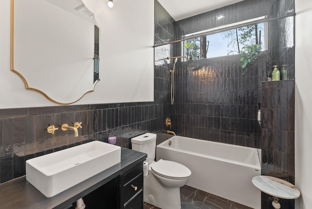 7617 S Cedar Rd, Spokane, WA 99224 - bathroom featuring tile walls, shower / washtub combination, vanity, and marble look tile flooring
