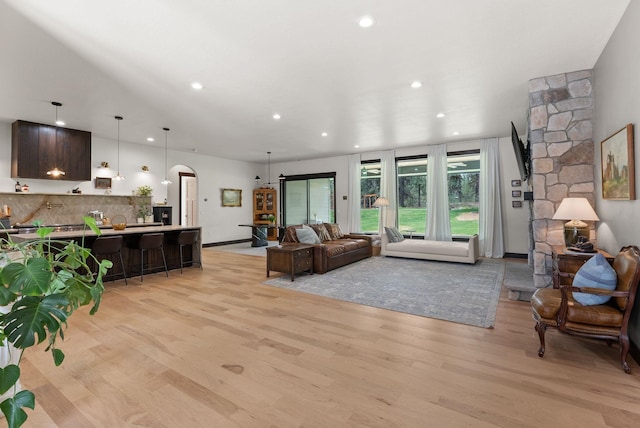 7617 S Cedar Rd, Spokane, WA 99224 - living area with arched walkways, light wood-style flooring, and recessed lighting