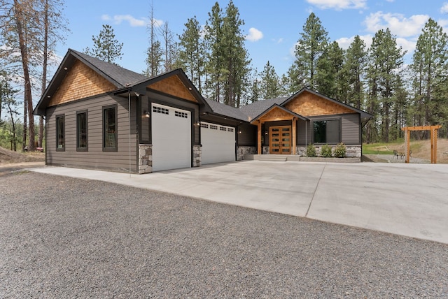 7617 S Cedar Rd, Spokane, WA 99224 - view of front facade with an attached garage, french doors, driveway, stone siding, and a shingled roof