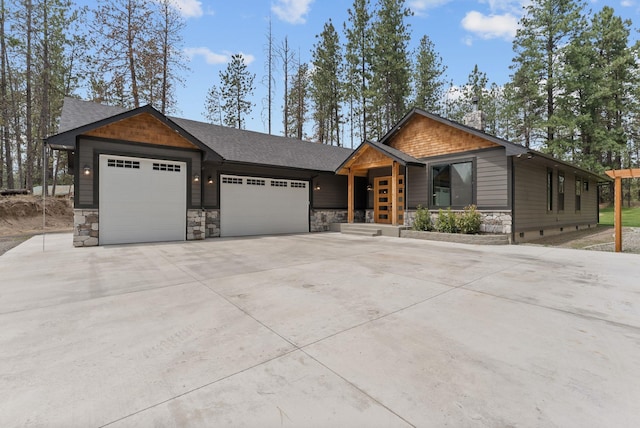 7617 S Cedar Rd, Spokane, WA 99224 - view of front of property featuring a garage, stone siding, and driveway
