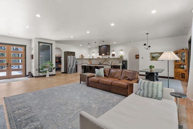 7617 S Cedar Rd, Spokane, WA 99224 - living area featuring arched walkways, light wood-style flooring, and recessed lighting
