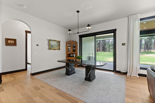 7617 S Cedar Rd, Spokane, WA 99224 - dining room with light wood-type flooring and arched walkways