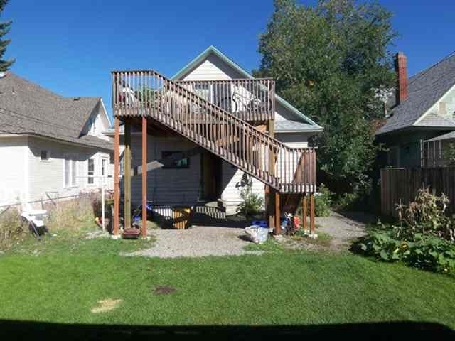 2613 W Gardner Ave, Spokane, WA 99201 - rear view of property featuring a deck and stairway