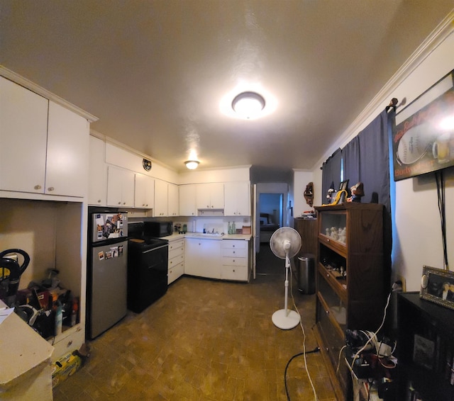 2613 W Gardner Ave, Spokane, WA 99201 - kitchen featuring electric stove, freestanding refrigerator, white cabinetry, black microwave, and light countertops