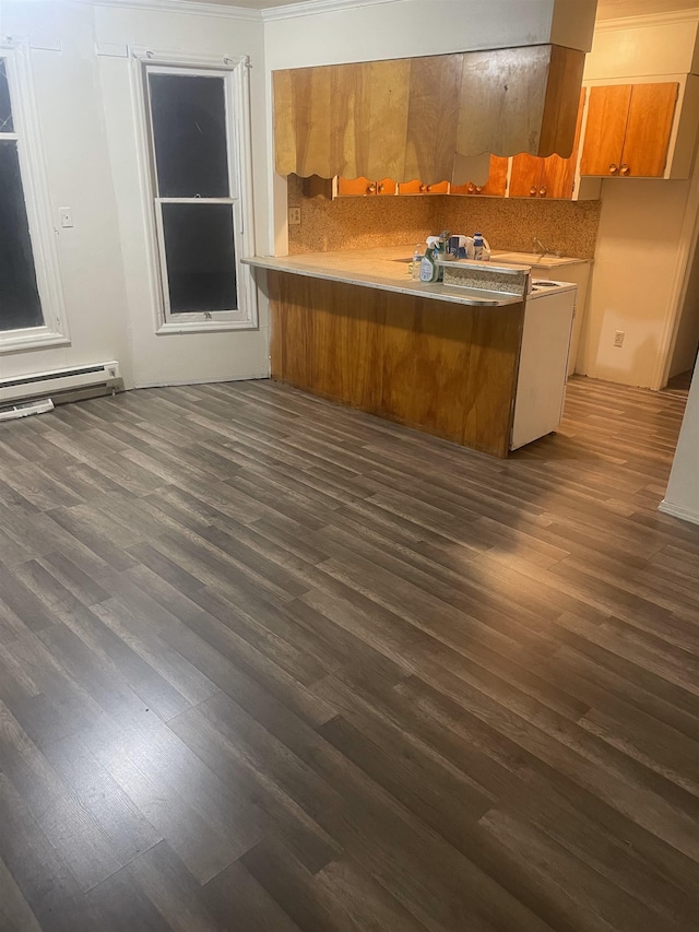 2613 W Gardner Ave, Spokane, WA 99201 - kitchen featuring brown cabinets, dark wood-type flooring, a peninsula, and light countertops
