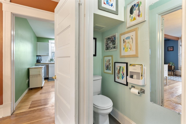 2103 W 5th Ave, Spokane, WA 99201 - bathroom featuring toilet and wood finished floors