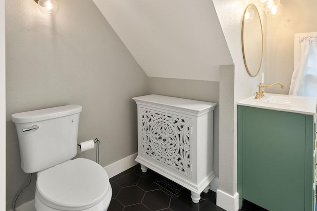 2103 W 5th Ave, Spokane, WA 99201 - bathroom with vanity, tile patterned flooring, and vaulted ceiling