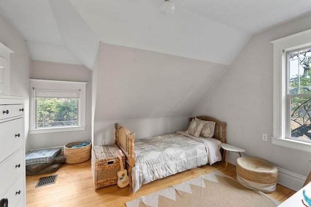 2103 W 5th Ave, Spokane, WA 99201 - bedroom featuring lofted ceiling, multiple windows, and light wood-style flooring