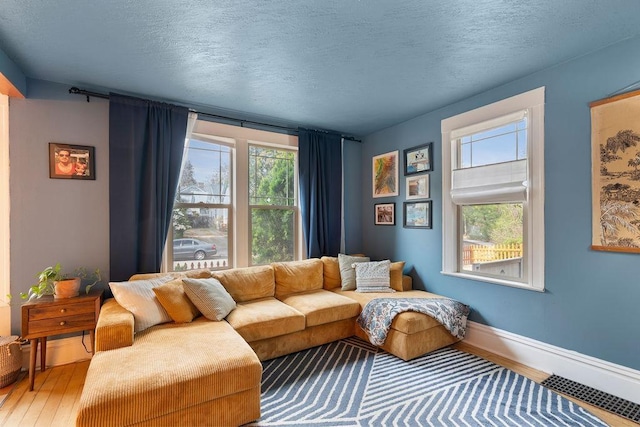 2103 W 5th Ave, Spokane, WA 99201 - living room with wood finished floors and a textured ceiling