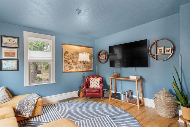 2103 W 5th Ave, Spokane, WA 99201 - living room with wood-type flooring and a textured ceiling