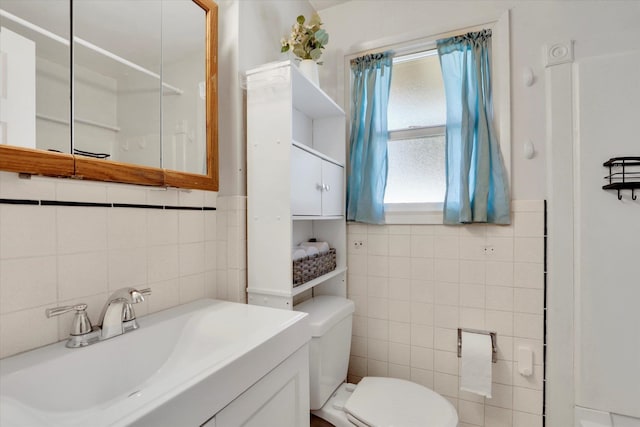 3511 W Francis Ave, Spokane, WA 99205 - bathroom featuring tile walls, vanity, and a shower