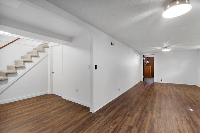 3511 W Francis Ave, Spokane, WA 99205 - finished basement featuring wood finished floors, stairway, and a textured ceiling