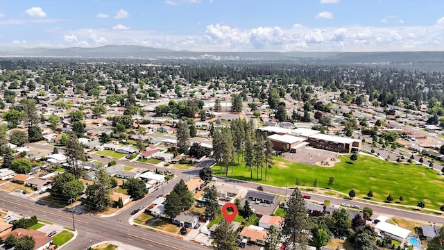 3511 W Francis Ave, Spokane, WA 99205 - aerial overview of property's location with a mountainous background and nearby suburban area