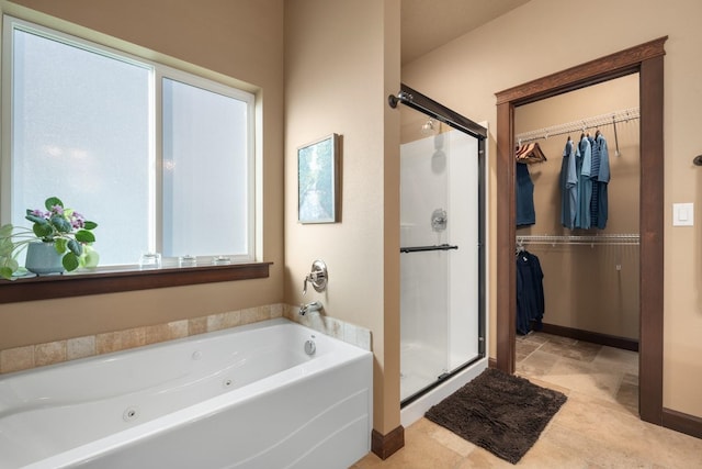 2820 S Galway Ln, Spokane Valley, WA 99037 - bathroom with a shower stall, a tub with jets, and a walk in closet