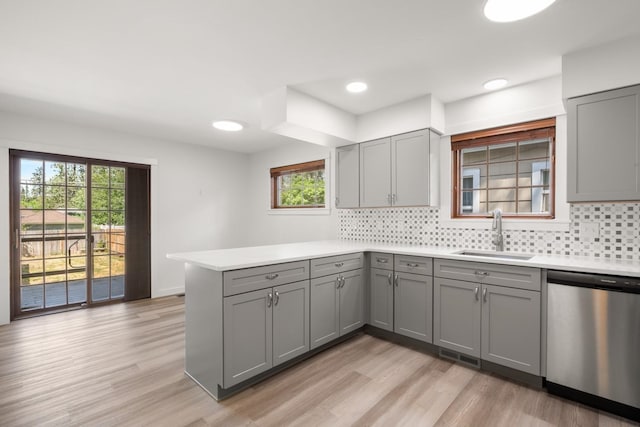 17 E 34th Ave, Spokane, WA 99203 - kitchen with stainless steel dishwasher, gray cabinets, a peninsula, tasteful backsplash, and recessed lighting