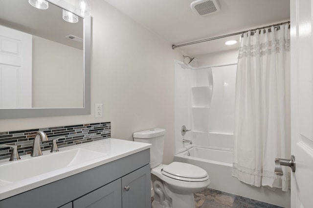 17 E 34th Ave, Spokane, WA 99203 - full bath with vanity, shower / bath combo with shower curtain, decorative backsplash, and stone finish flooring