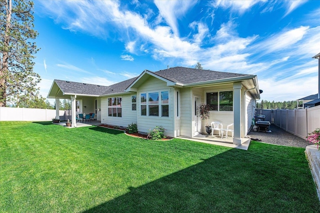 9302 W Floyd Dr, Cheney, WA 99004 - rear view of property with a patio, a fenced backyard, and roof with shingles