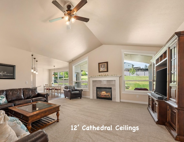 9302 W Floyd Dr, Cheney, WA 99004 - living area featuring ceiling fan, a tile fireplace, vaulted ceiling, and light carpet