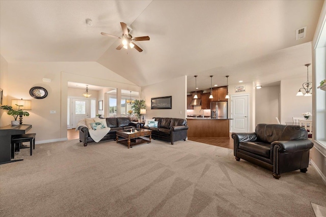 9302 W Floyd Dr, Cheney, WA 99004 - living room with light carpet, ceiling fan, and lofted ceiling