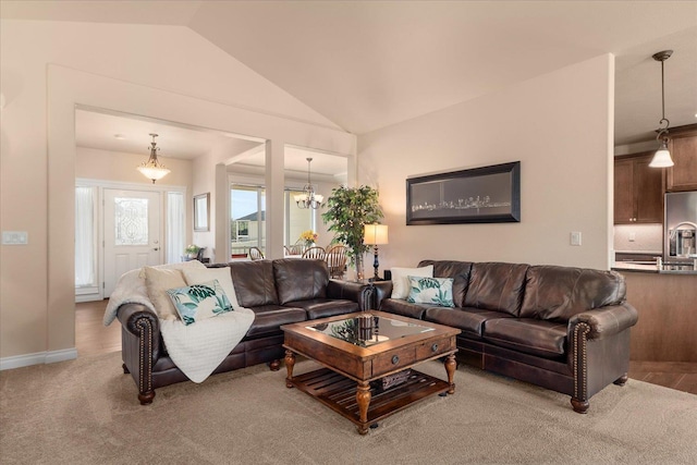 9302 W Floyd Dr, Cheney, WA 99004 - living area featuring lofted ceiling, a chandelier, and light carpet