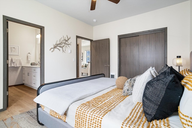 10718 E Augusta Rd, Spokane, WA 99207 - bedroom with light wood-style floors, a closet, ensuite bath, and ceiling fan