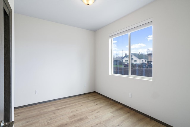10718 E Augusta Rd, Spokane, WA 99207 - empty room with light wood-style floors and baseboards