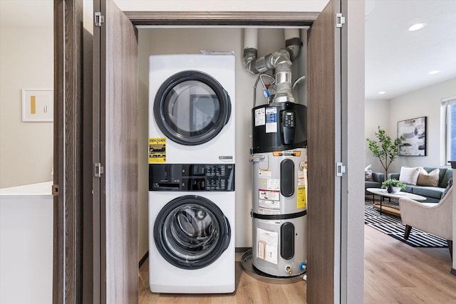 10718 E Augusta Rd, Spokane, WA 99207 - laundry room with stacked washer / drying machine, wood finished floors, water heater, and recessed lighting