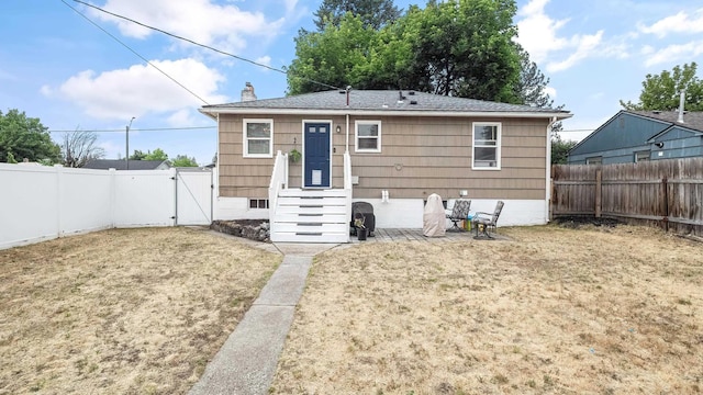 4204 W Olympic Ave, Spokane, WA 99205 - rear view of property with a gate, a fenced backyard, and a chimney