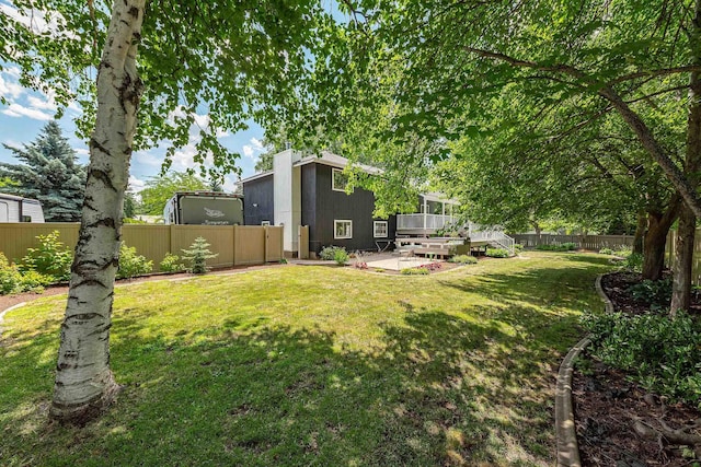 2913 E 61st Ct, Spokane, WA 99223 - fenced backyard featuring a deck and a patio