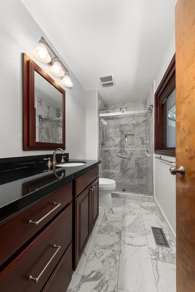 2913 E 61st Ct, Spokane, WA 99223 - bathroom featuring marble finish flooring, a marble finish shower, and vanity