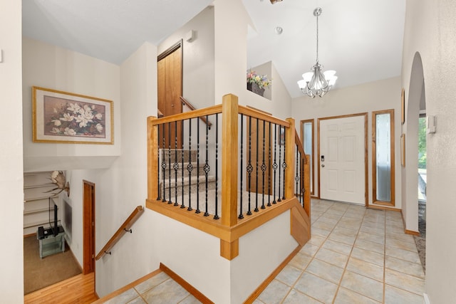 2913 E 61st Ct, Spokane, WA 99223 - foyer with stairway, arched walkways, a chandelier, and lofted ceiling