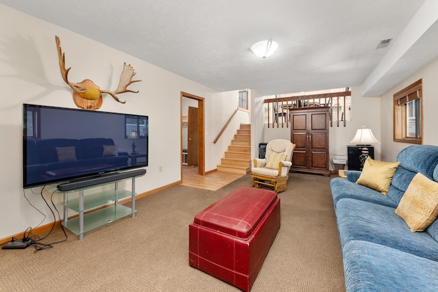 2913 E 61st Ct, Spokane, WA 99223 - carpeted living area featuring stairs and baseboards