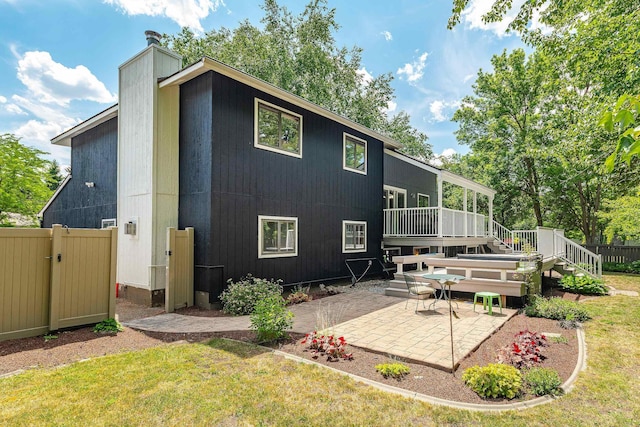 2913 E 61st Ct, Spokane, WA 99223 - back of house featuring a deck, a patio area, stairs, and a chimney