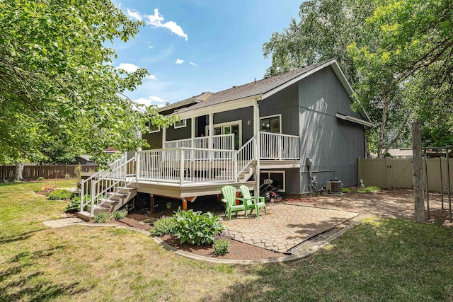 2913 E 61st Ct, Spokane, WA 99223 - back of property with stairway, a fenced backyard, a patio area, a wooden deck, and a gate