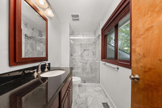 2913 E 61st Ct, Spokane, WA 99223 - full bathroom with marble look tiles, vanity, and a marble finish shower