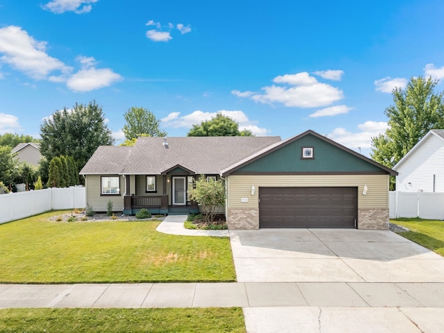 3518 S Woodlawn Dr, Spokane Valley, WA 99206 - ranch-style home featuring brick siding, a garage, concrete driveway, and covered porch