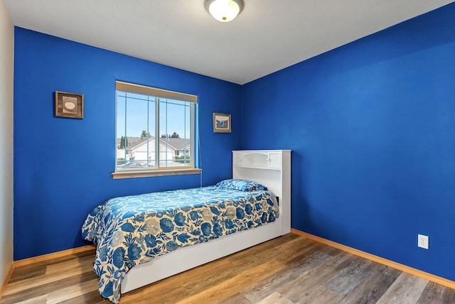 3518 S Woodlawn Dr, Spokane Valley, WA 99206 - bedroom featuring wood finished floors and baseboards